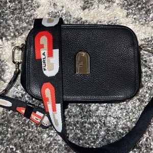 Furla black and gold crossbody.